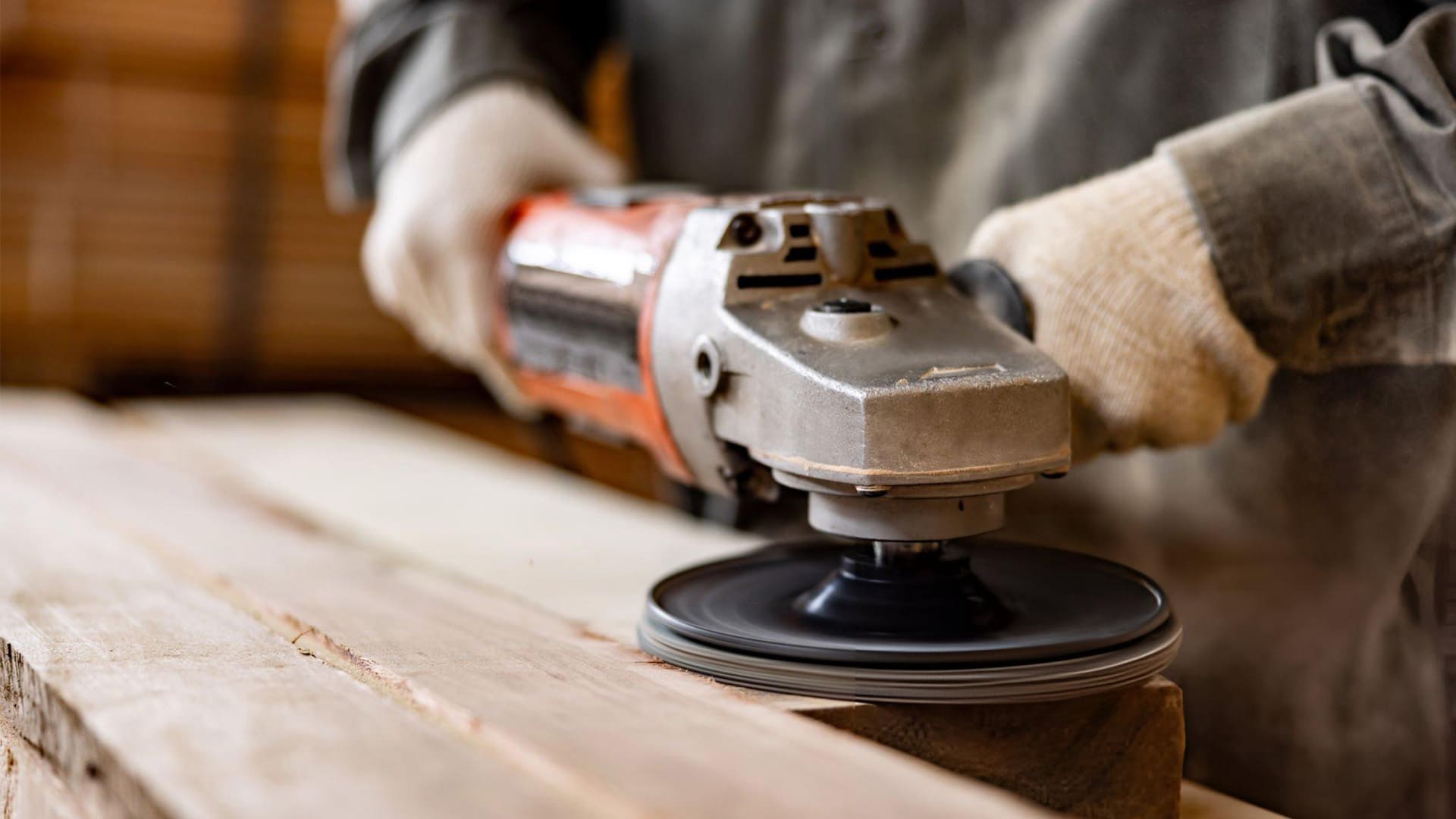 a person is using an orbital sander to smooth the wood